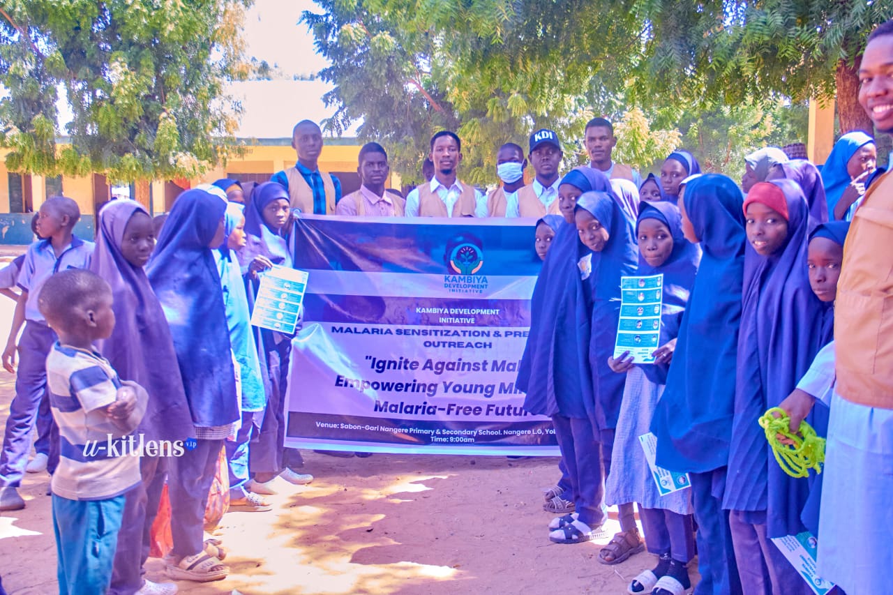 KDI team and students with Ignite Against Malaria banner at Sabon-Gari Nangere School, Yobe State