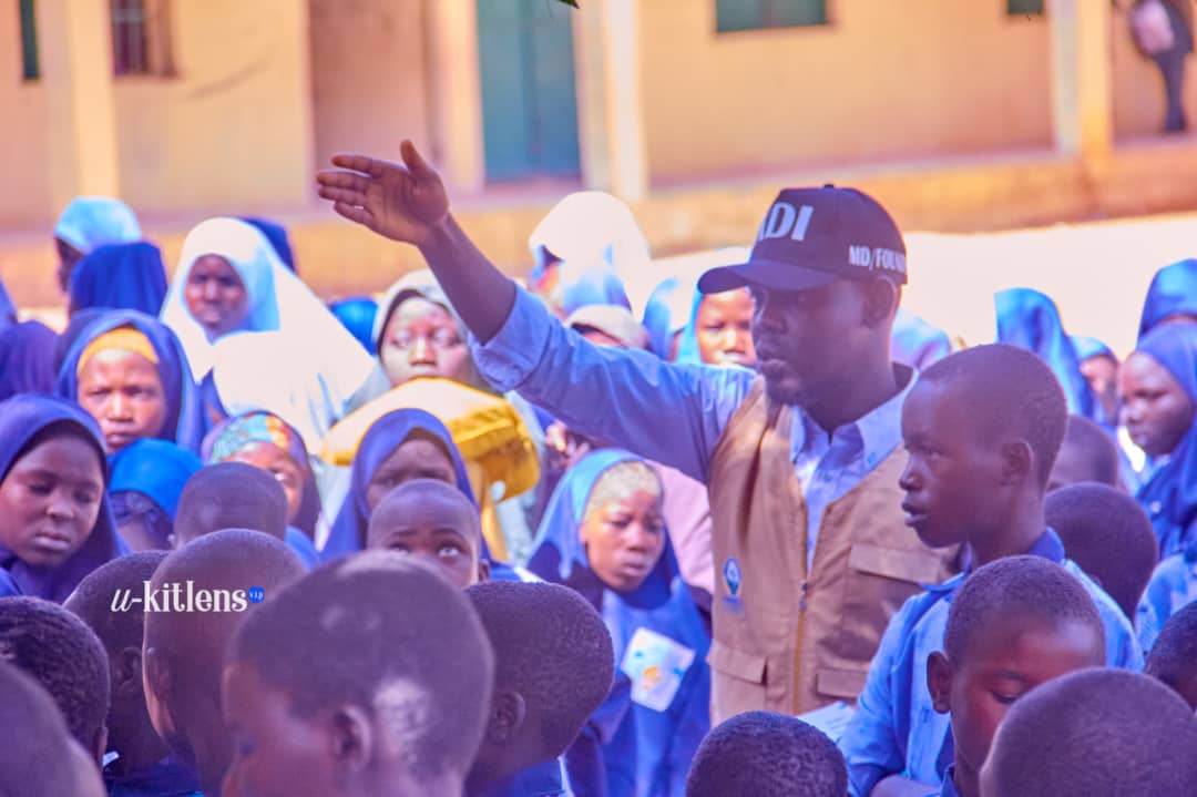 KDI MD/Founder engaging directly with students during the malaria outreach